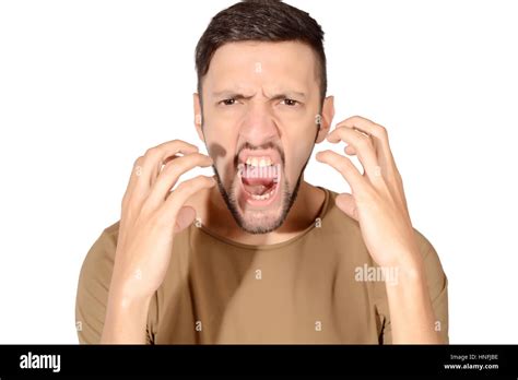 Portrait Of A Young Man With Angry Expression Isolated White