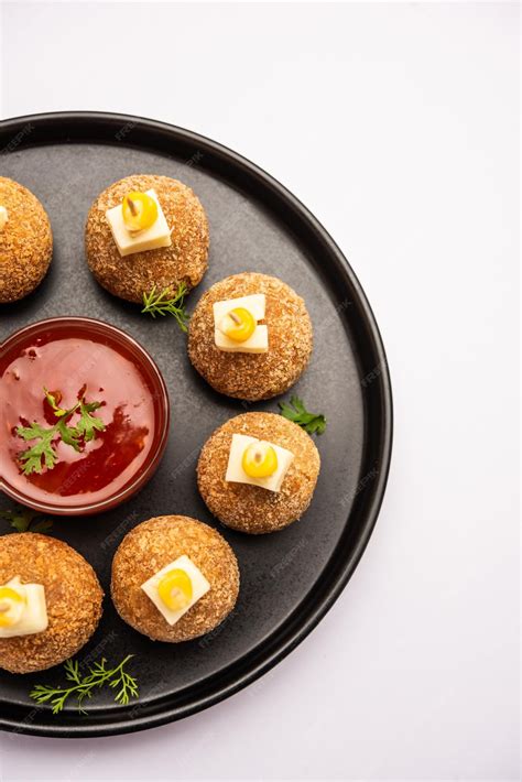 Premium Photo | Corn cheese balls with dip popular party snack from india