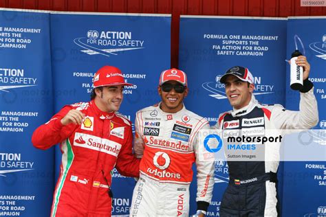 L To R Fernando Alonso Esp Ferrari Pole Sitter Lewis Hamilton