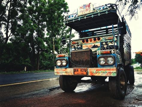 Premium Photo Truck Parked On Wet Road Against Trees