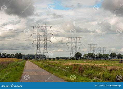 Long Row Of Double High Voltage Pylons In A Dutch Landscape Stock Photo