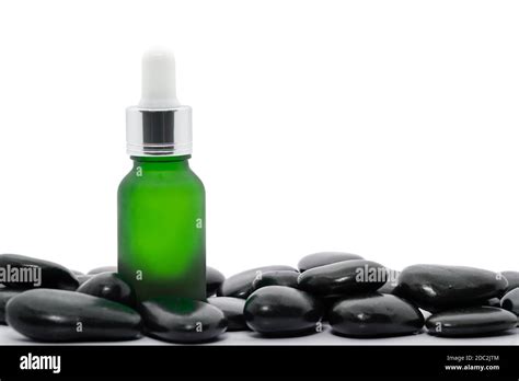 Serum Oil Bottle Dropper Mock Up Or Essential Oil With Black Stone On White Background Stock