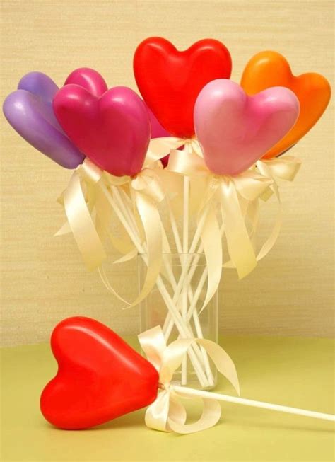 There Are Many Heart Shaped Balloons In The Vase