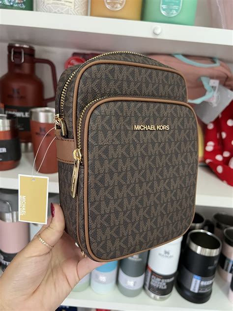 Bolsa Michael Kors Jet Set Travel Signature Marrom