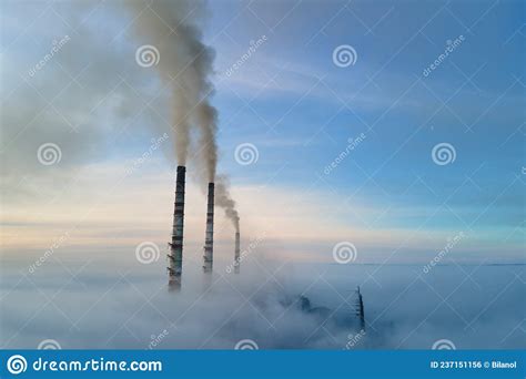 Coal Power Plant High Pipes With Black Smoke Moving Upwards Polluting