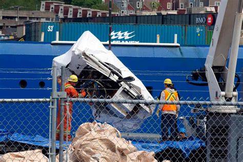 Photos: ‘Titan’ Sub Debris Hauled Ashore After Recovery