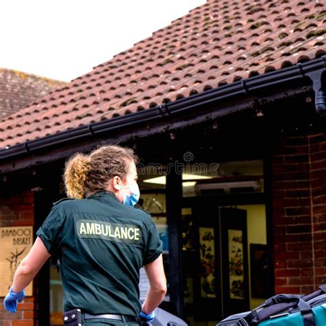 Nhs Ambulance Paramedic In Uniform On An Emergency Call Editorial Image