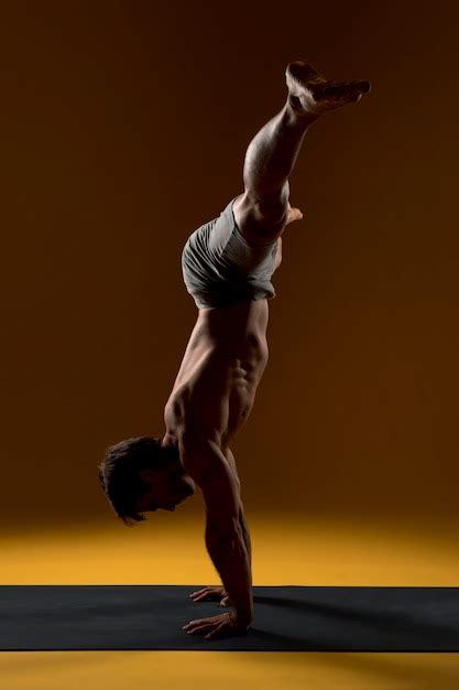 Free Photo | Handstand yoga pose on mat