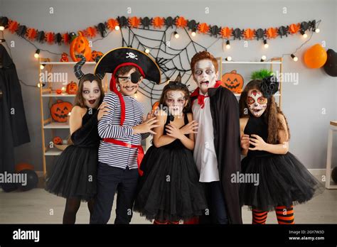 Portrait of group of children in creative costumes with scared faces at Halloween party Stock ...