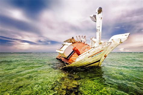 Shipwrecks On A Coral Reef Of Tropical Photograph By Apomares Fine