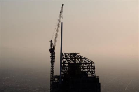 Premium Photo Crane At Construction Site Against Sky