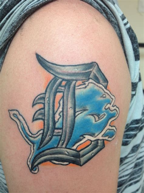 My Detroit Lions/Tigers tattoo | Lion tattoo design, Tiger face tattoo ...