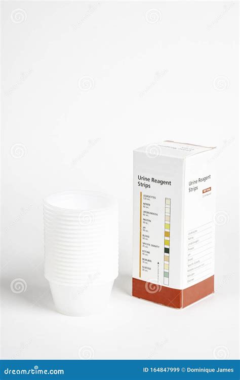 Urine Strips Box And A Stack Of Plastic Containers Editorial Stock