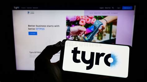 Person Holding Cellphone With Logo Of Australian Fintech Company Tyro