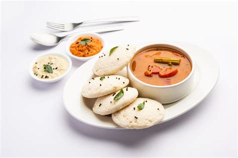 Idly Sambar Or Idli With Sambhar And Green Red Chutney Popular South