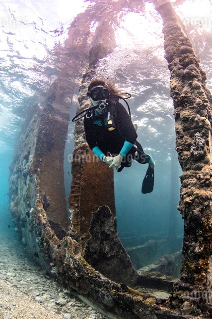 Underwater View Of Female Scuba Diver Exploring Sapona Wreck Alice