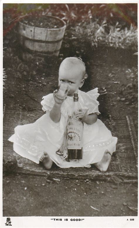 This Is Good Baby Drinking From Mug Holds Dewar S Whiskey Bottle