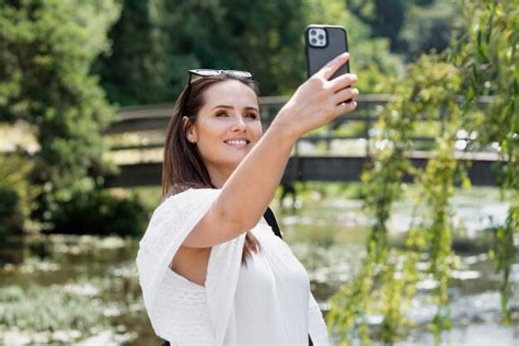 Free Photo Young Female Traveler Taking A Selfie