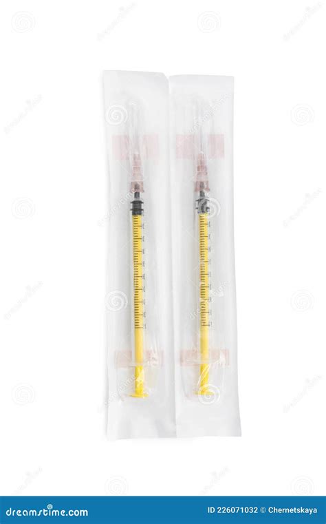 Packed Disposable Syringes With Needles On White Background Top View