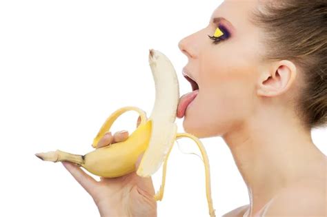 Woman eating peeled banana Stock Photo by ©ffotograff65 22677317