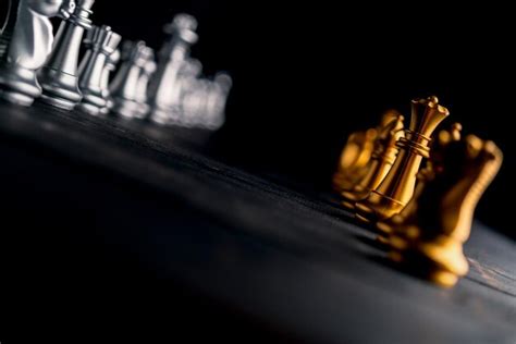 Premium Photo Close Up Of Chess Pieces On Board In Darkroom