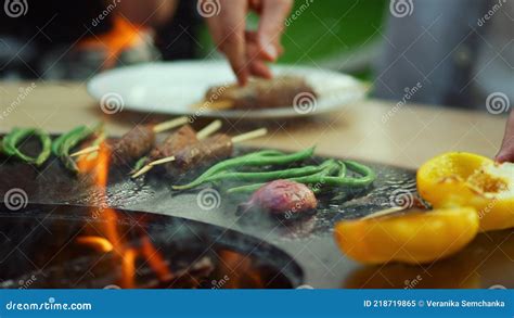 Friends Eating Bbq Food Outside Man And Woman Taking Food From Bbq