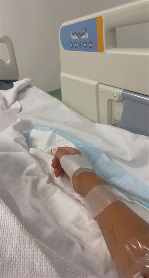 An Infant In A Hospital Bed With Ivs Attached To The Back Of It S Head