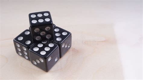 Black Dice With White Dots Isolated On White Background Stock Photo