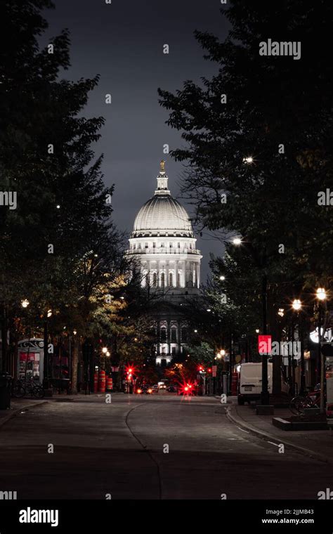 A Vertical Shot Of Wisconsin State Capitol Building At Night In