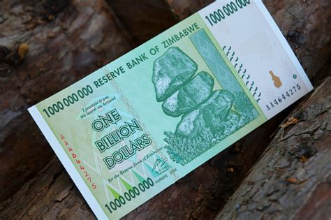 A one billion dollar bill sitting on top of a tree photo – Free Blue