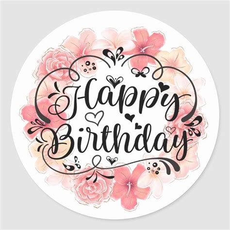 a round sticker with the words happy birthday written in black and pink flowers on it