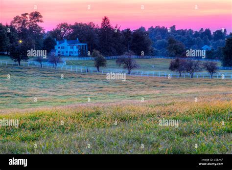 Sunset on a horse farm Stock Photo - Alamy