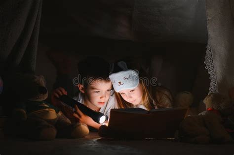 Little Children Reading Bedtime Story at Home. Stock Image - Image of ...