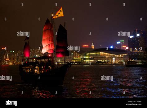 The Iconic Chinese Red Sail Junk In Victoria Harbour At Night Sails