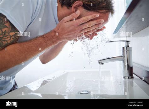 Helping My Skin Restore Its Ph Balance Shot Of A Man Washing His Face