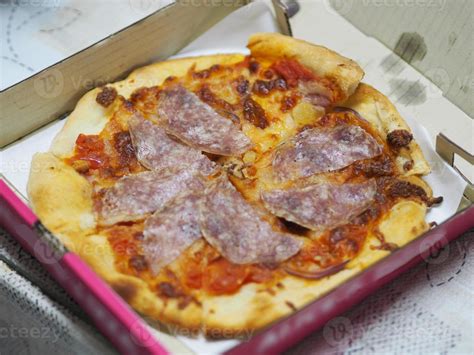 Pizza Salami on top dried sausage with and Pizza Sauce cheese in paper ...