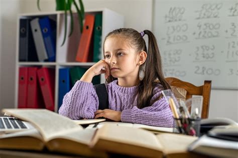 Premium Photo Portrait Of A Beautiful Girl In The Classroom At A Desk