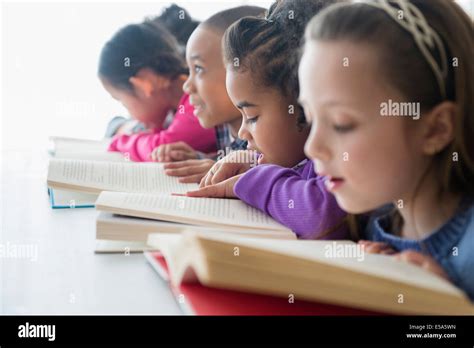 Students Reading In Classroom Stock Photo Alamy