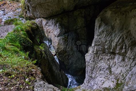 Waterfall in a cave stock photo. Image of creek, moist - 259589678