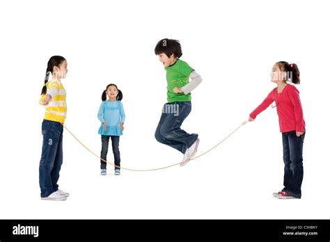 group  friends playing jump rope stock photo alamy