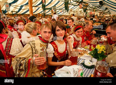 Belarusians Dressed In National Costume Sitting In A Beer Tent At A