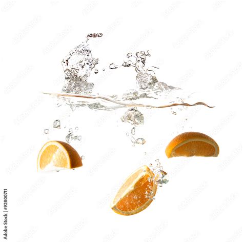 Orange splash on water, isolated on white background Stock Photo ...