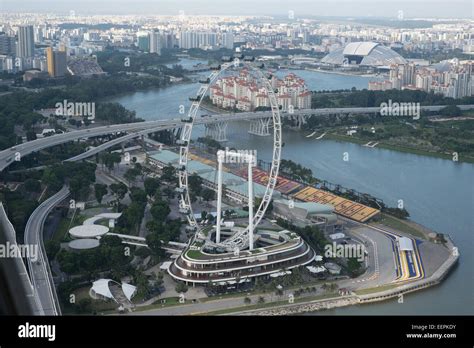 Singapore Flyer Giant Ferris Wheel In Singapore As Seen From The Sky