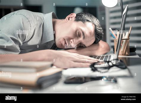 Sleepy man resting putting his head on the office table Stock Photo - Alamy