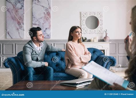 Couple Visiting A Psychologist And Having A Psychological Session While