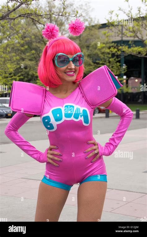 A Beautiful Slender Model In A Space Costume With A Pink Wig And