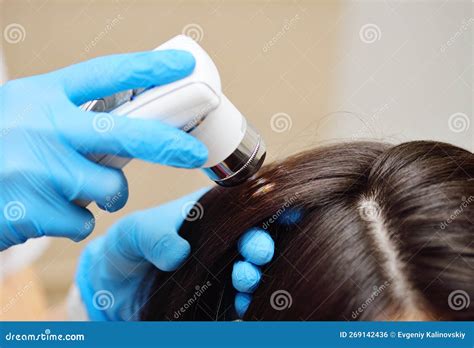 A Close Up Of A Cosmetologist Trichologist Diagnoses The Condition Of