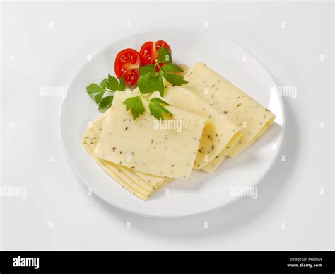 thin sliced cheese flavored with herbs Stock Photo - Alamy