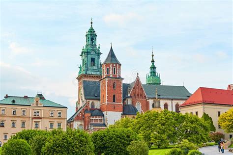 The Courtyard Is Buried In Flowers And Greenery In The Ancient Zamek