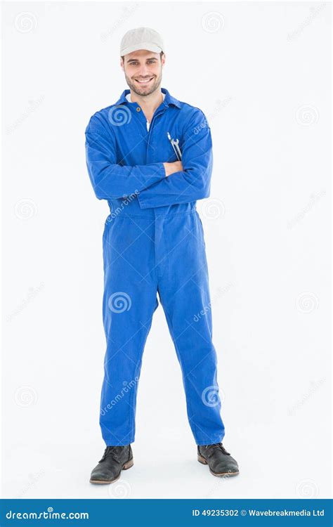 Male Mechanic Standing Arms Crossed On White Background Stock Photo